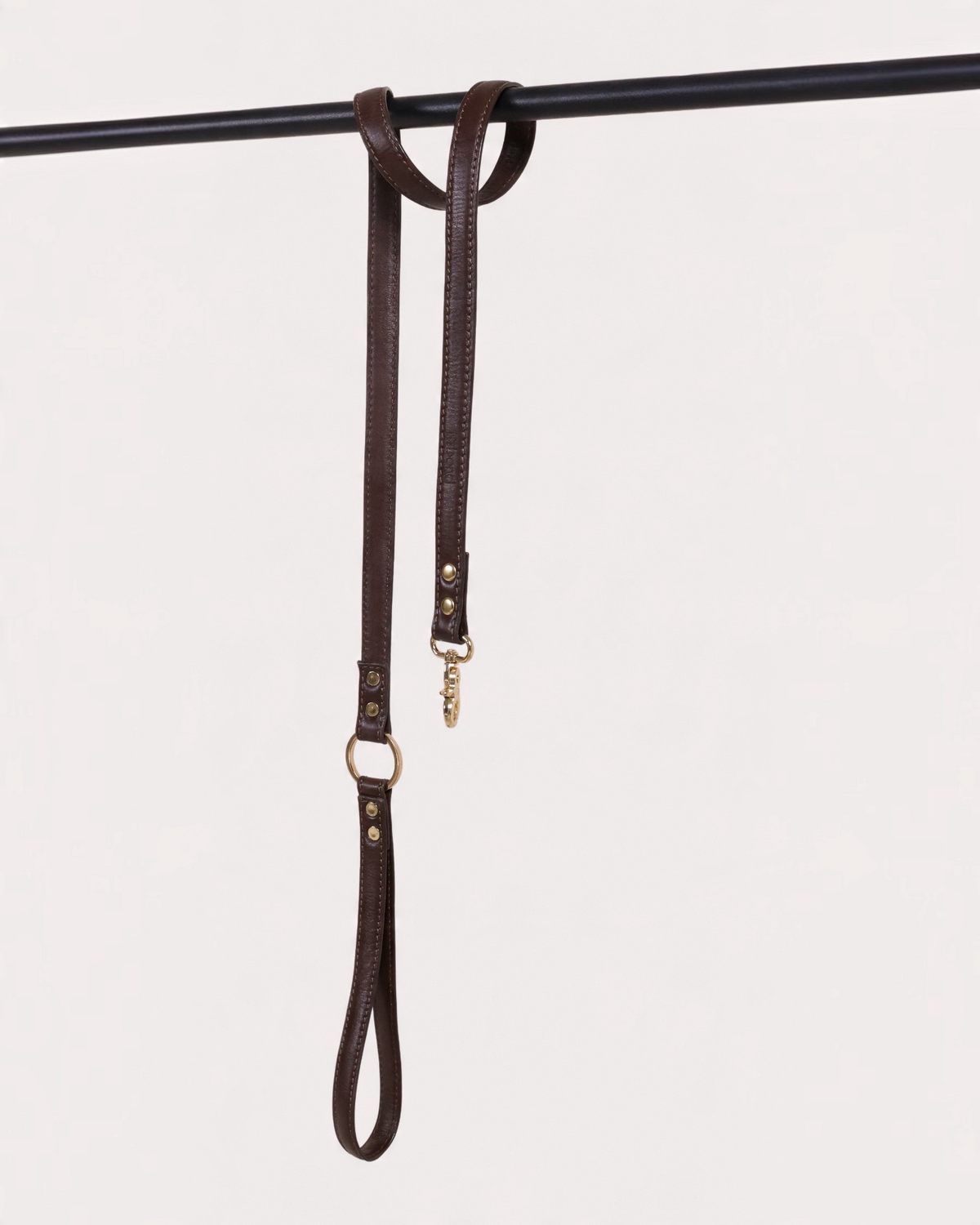The bond dark brown vegetable tanned leather dog lead with solid zinc hardware and swivel snap hooks.