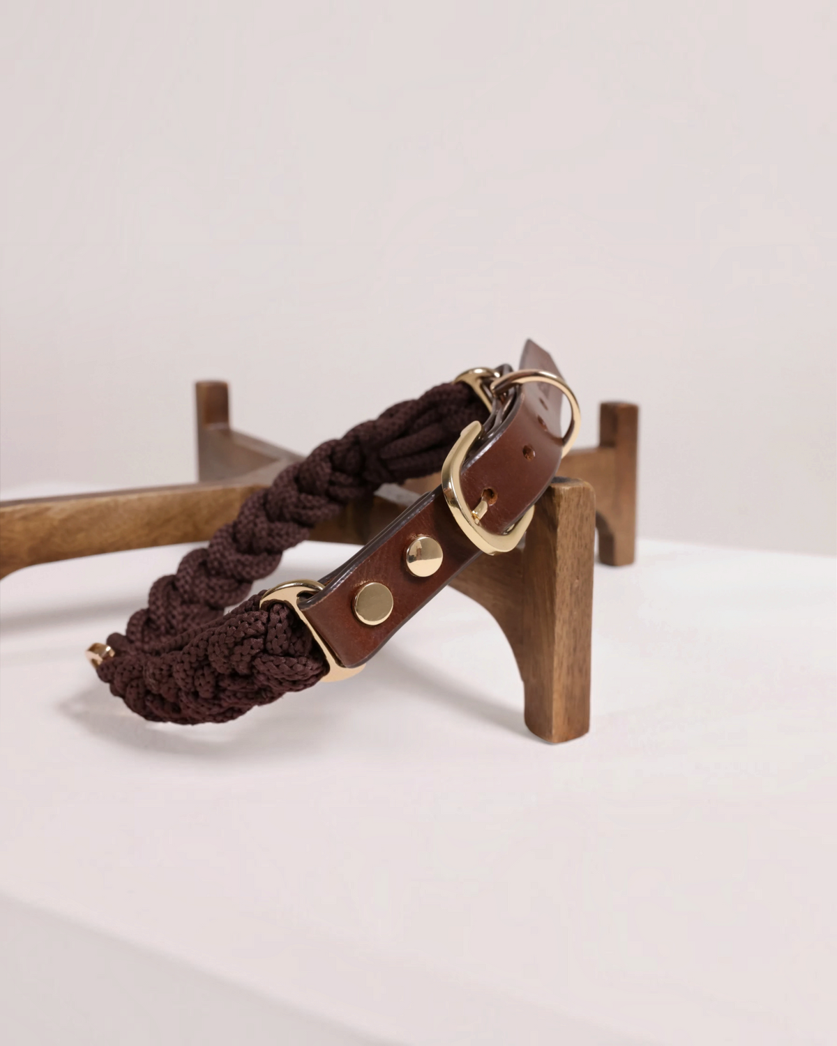 The bond Heirloom dog collar featuring dark brown braided rope and full-grain leather with polished brass hardware.