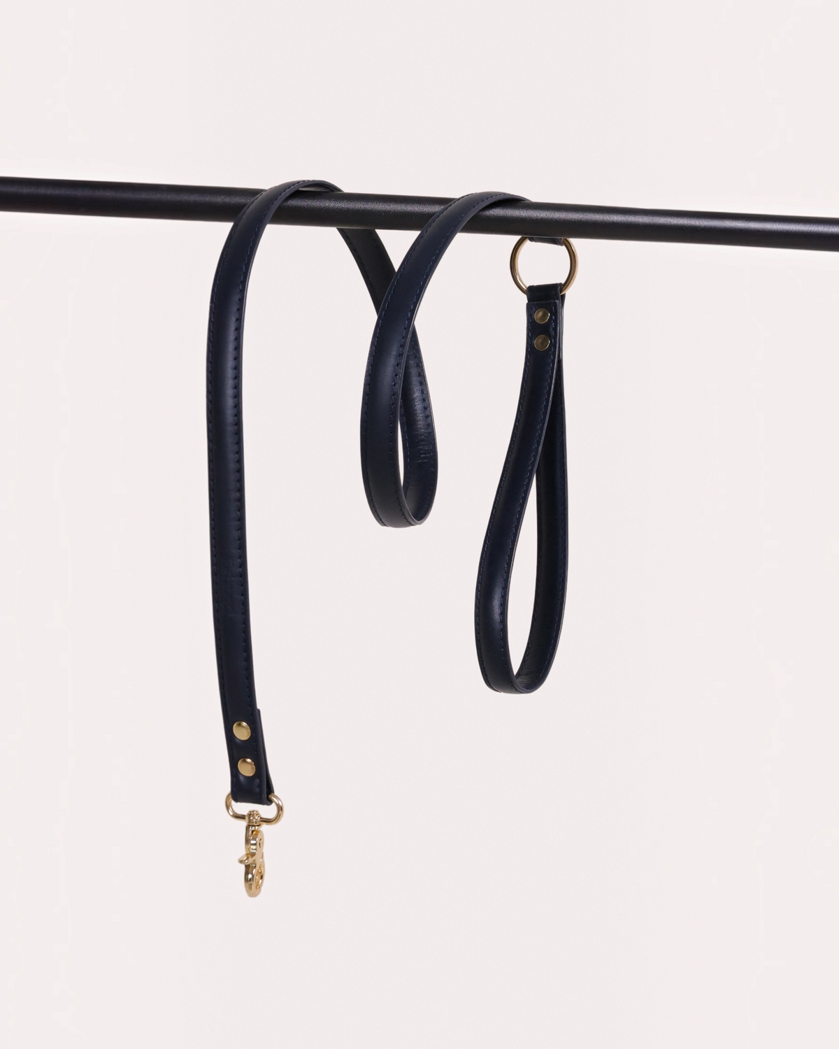 The bond navy blue vegetable tanned leather dog lead with solid zinc hardware and swivel snap hooks.